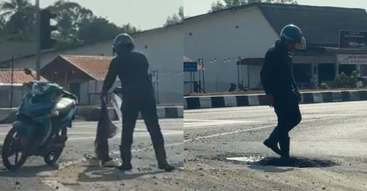lelaki tutup jalan berlubang